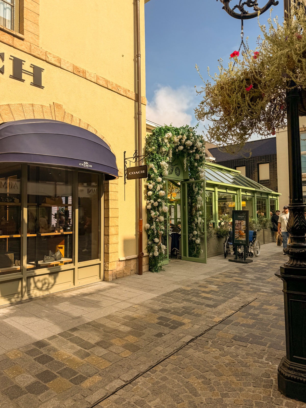 designer outlet, between the flowers