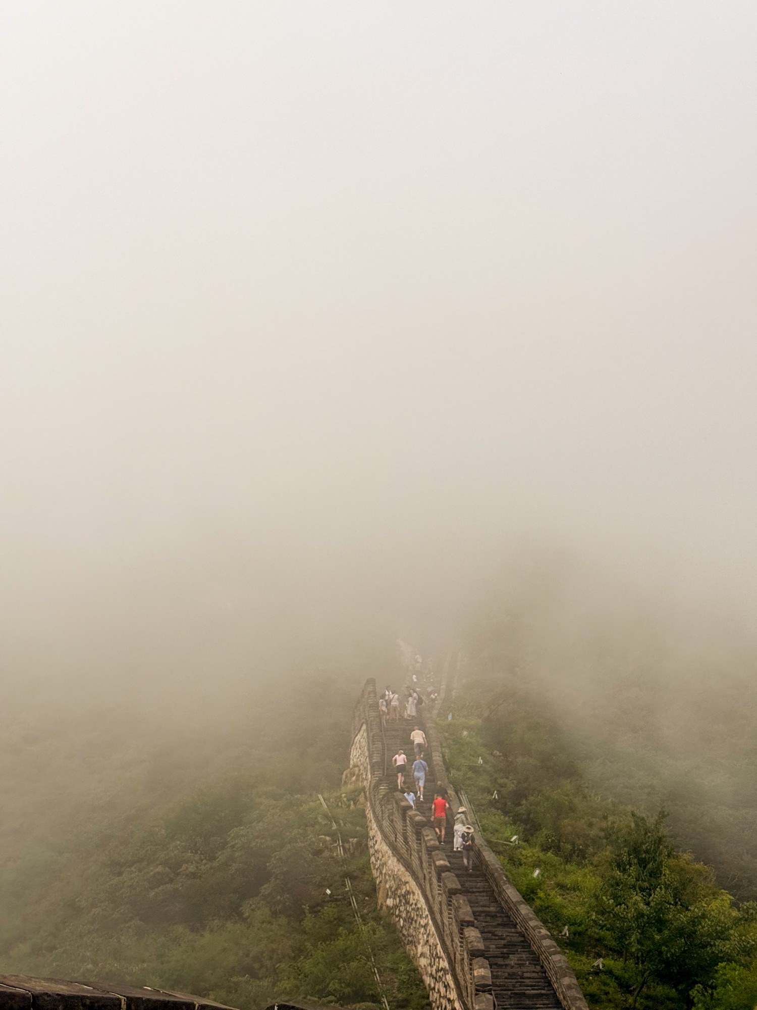 The Great Wall fading into a misty mountain landscape