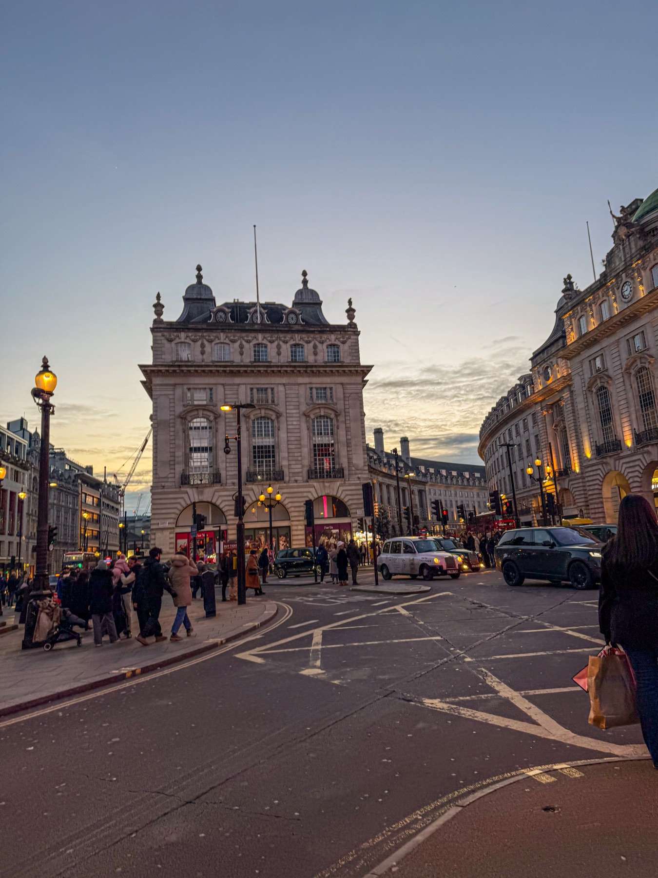 Piccadilly at dusk with traffic and illuminated buildings